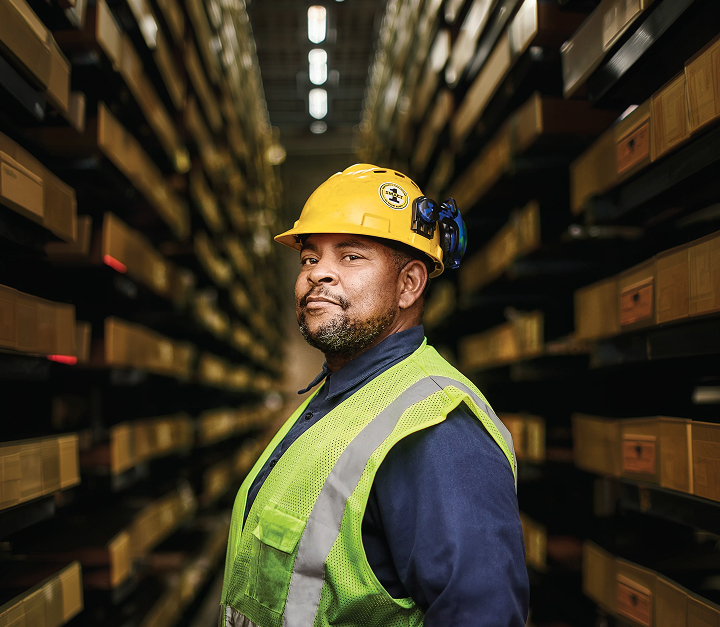 Reliance metals service center team embodying the company values of responsibility, relationships, results, and readiness across global operations